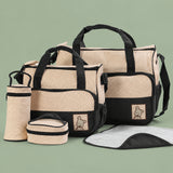 Complete 5-piece diaper bag set including large tote, small bag, bottle holder, food pouch, and changing pad.