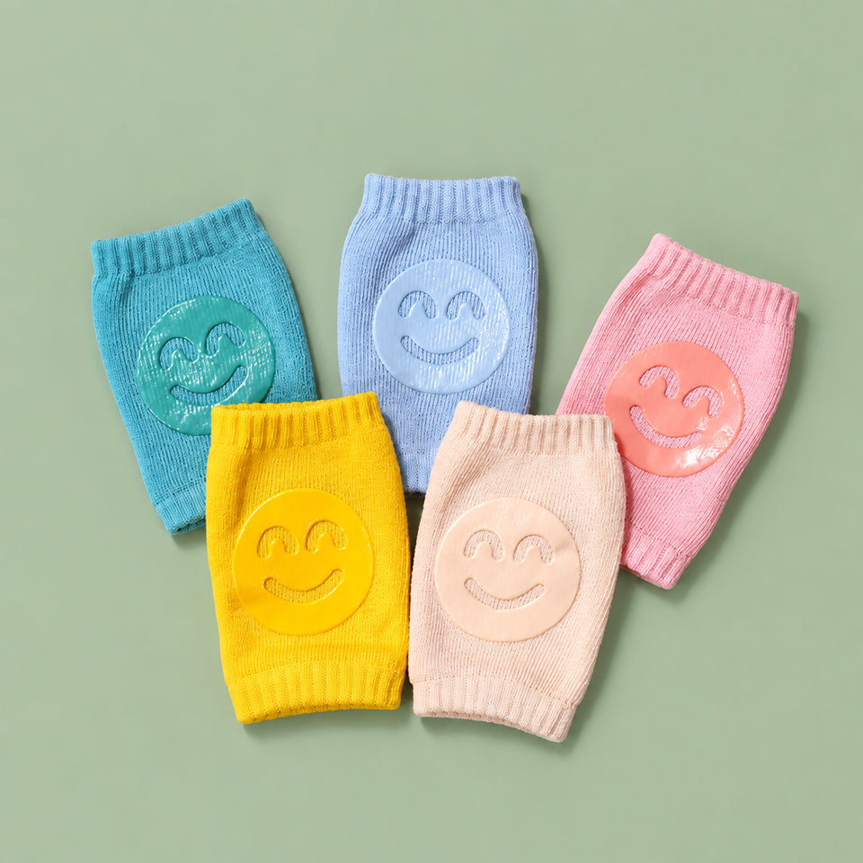 Close-up of non-toxic silicone traction dots on baby knee protector pads.
