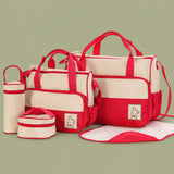 Compact snack pouch and small shoulder bag included in the matching diaper bag set.