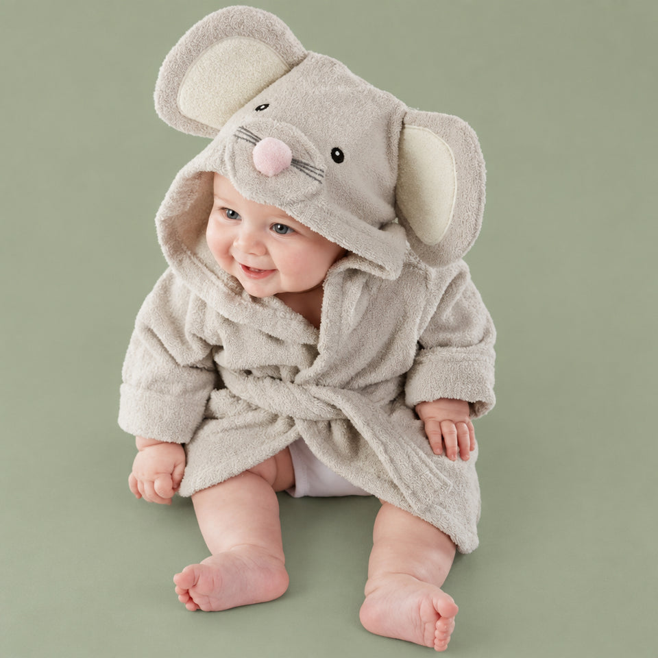 Baby wearing a soft organic cotton duck-themed hooded bath towel.