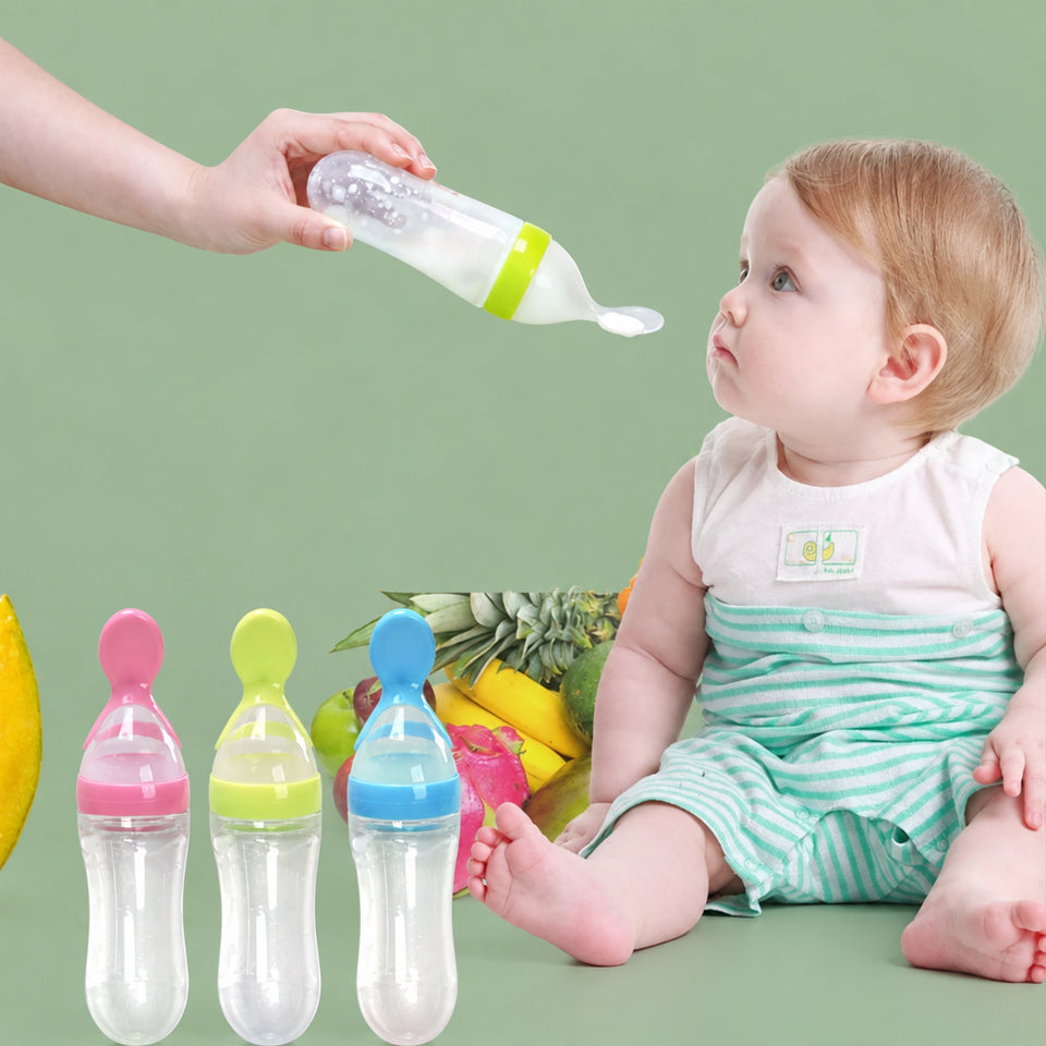 Silicone baby squeeze feeding spoon bottle in soft white showing the 90ml scale measurement.