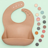 Close-up of the 4-button adjustable neck closure on a gentle BPA-free silicone baby bib.