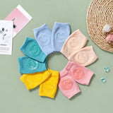 Multi-pack set of baby knee pads for crawling available in neutral colors.