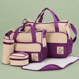 Large waterproof diaper bag tote packed with baby clothes, diapers, and travel accessories.
